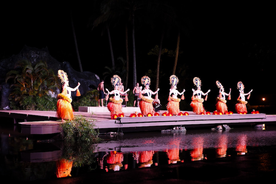 performers on stage dressed in traditional Tahiti costume