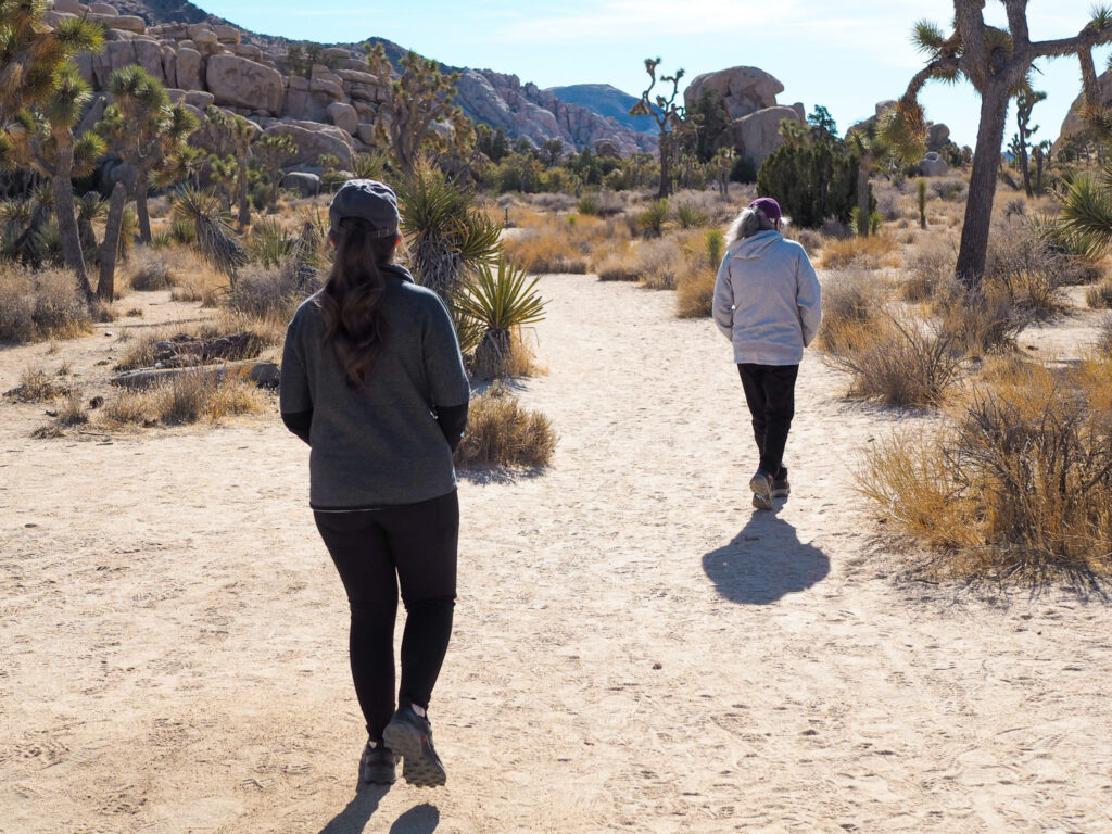 author and her grandma walking on the Barker Dam Trail  in Joshua Tree National Park