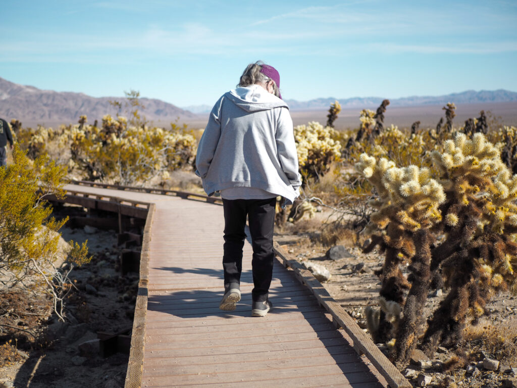 author's grandma on the trail at Cholla Cactus Garden at Joshua Tree National Park