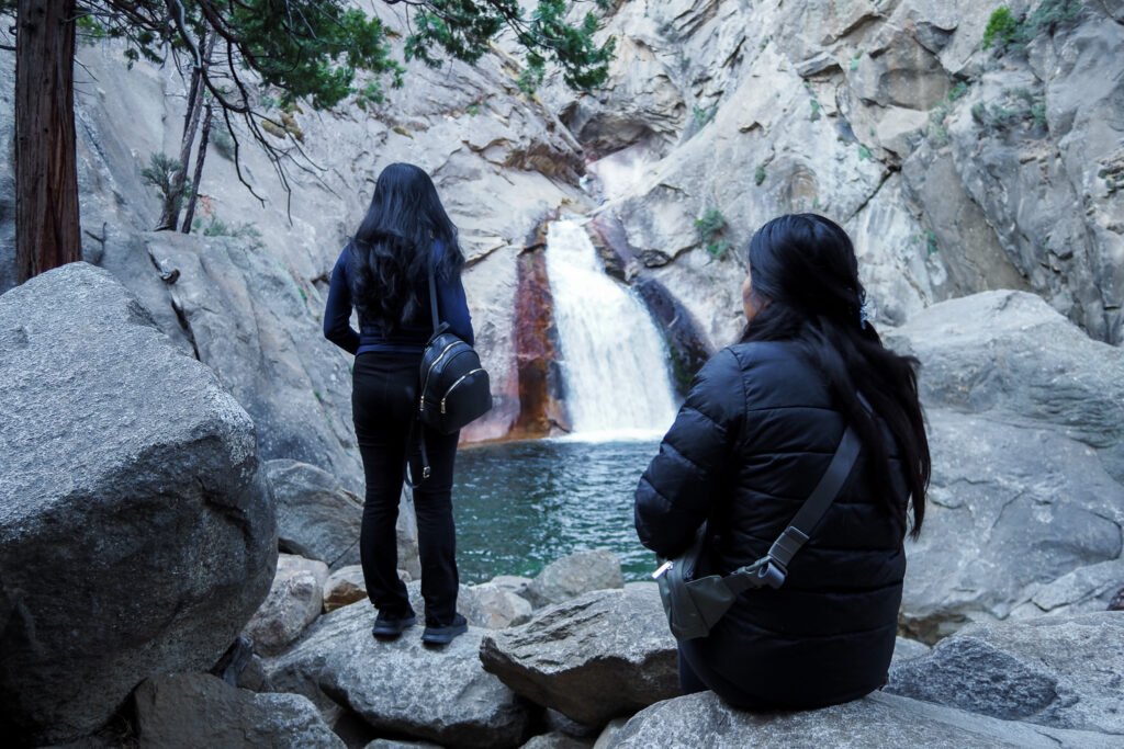 Two friends looking at Roaring River Falls in Kings Canyon National Park
