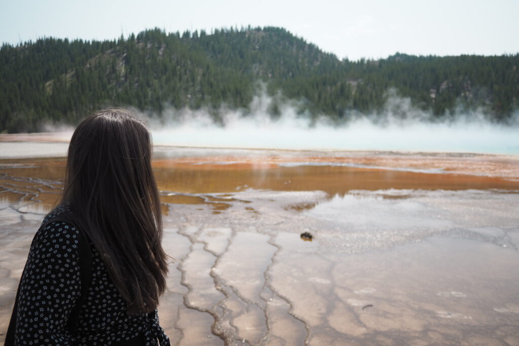 author in front of Grand Prismatic Spring at Yellowstone National Park