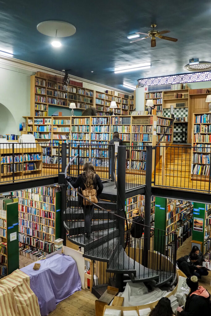 Author on the stairwell in Leakey's Bookshop in Inverness, Scotland
