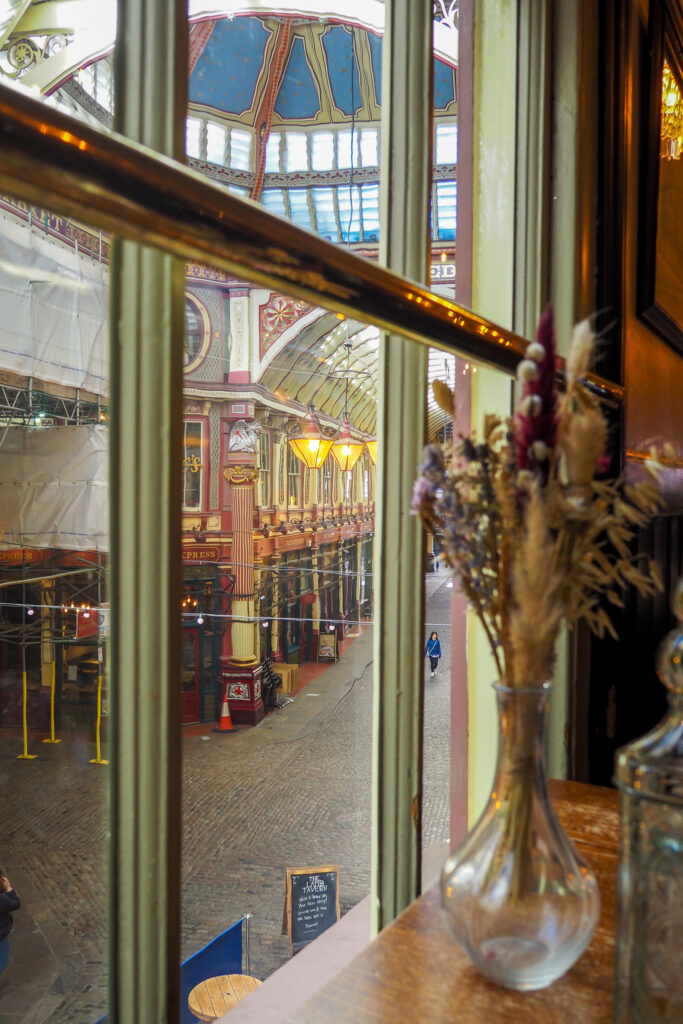 The window at the Lamb Tavern looking out to Leadenhall Market in London, England during a long layover