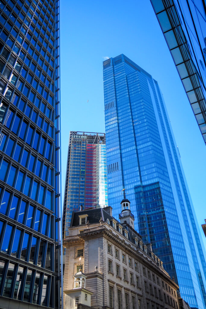 Tall skyscrapers against a blue sky in London, England