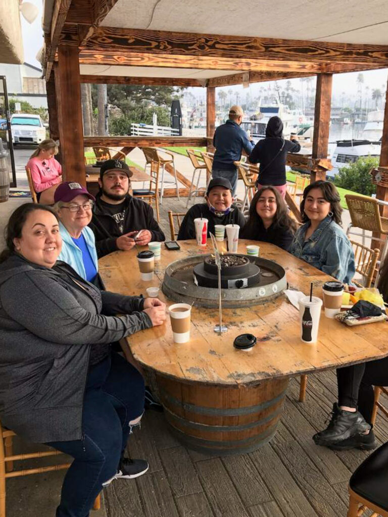 Author's family members around a large outdoor table at Harbor Cove Cafe
