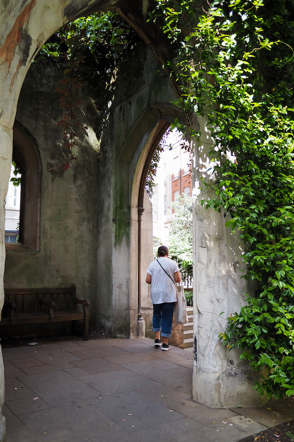 author's mom standing in an arched doorway at St Dunstan in the East
