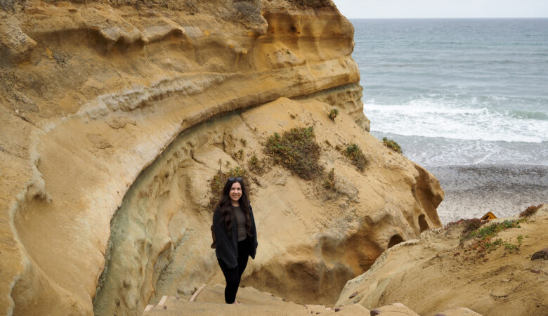 young woman on sandstone steps on the Torrey Pines beach trail