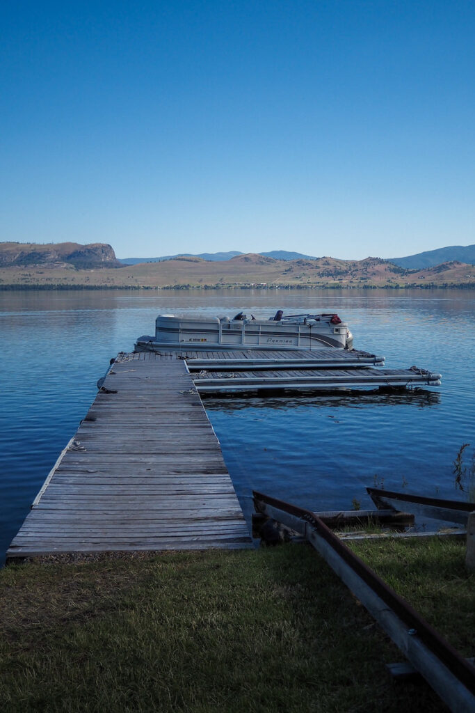 boat in flathead lake by the dock at big arm