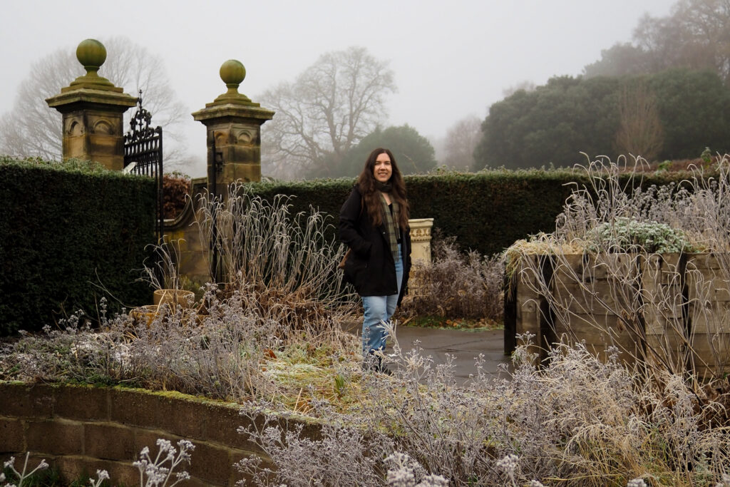 author, a young woman, in the garden at pollok house