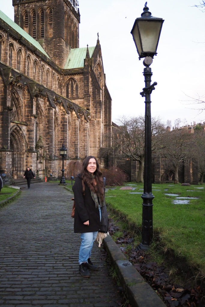 author, a young woman, standing in front of the Glasgow Cathedral