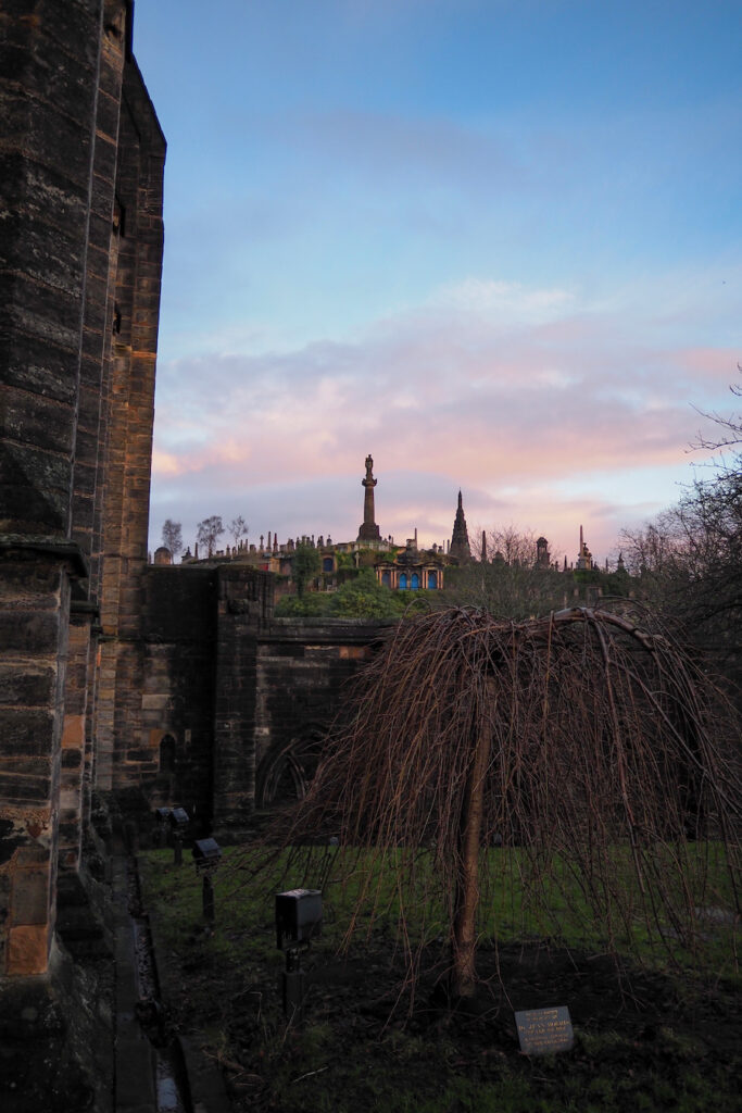 tombstones atop the Glasgow Necropolis at sunset