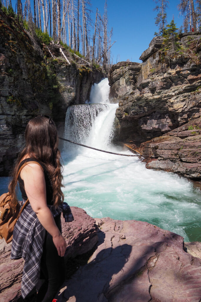a woman looking out to the St. Mary Falls
