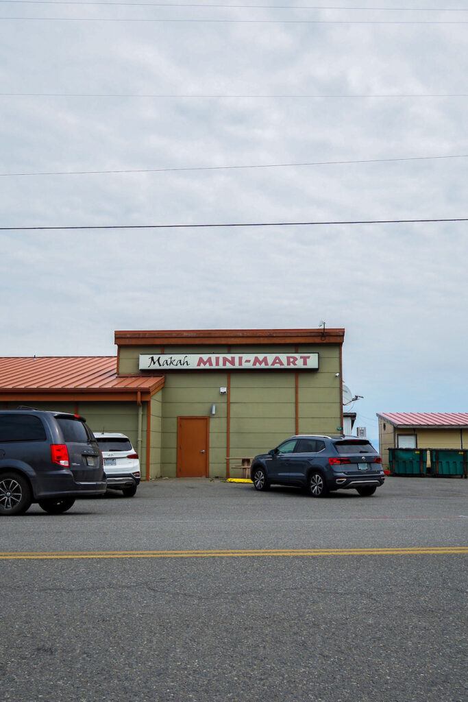 a small building with a sign that says "Makah Mini-Mart"
