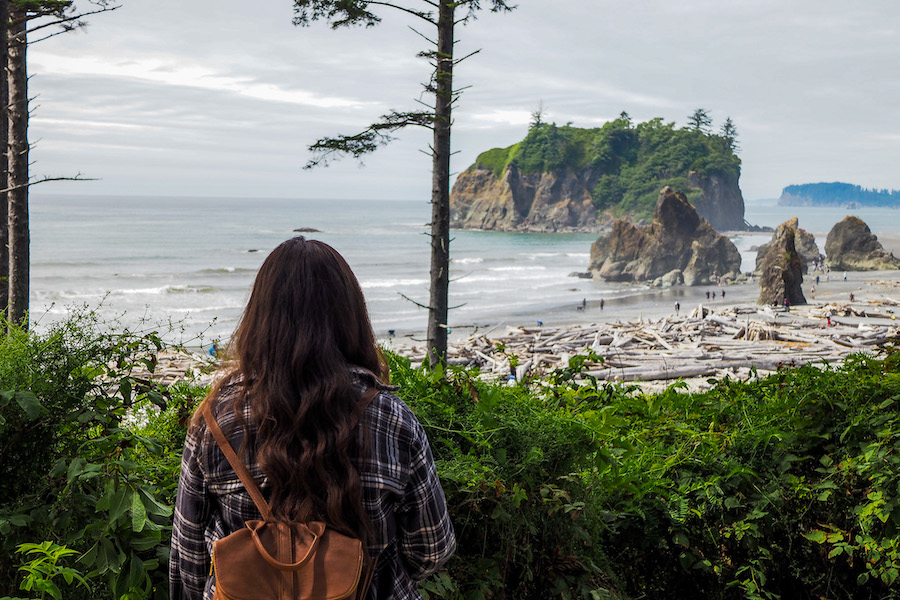 girl looking out at the view of Ruby Beach