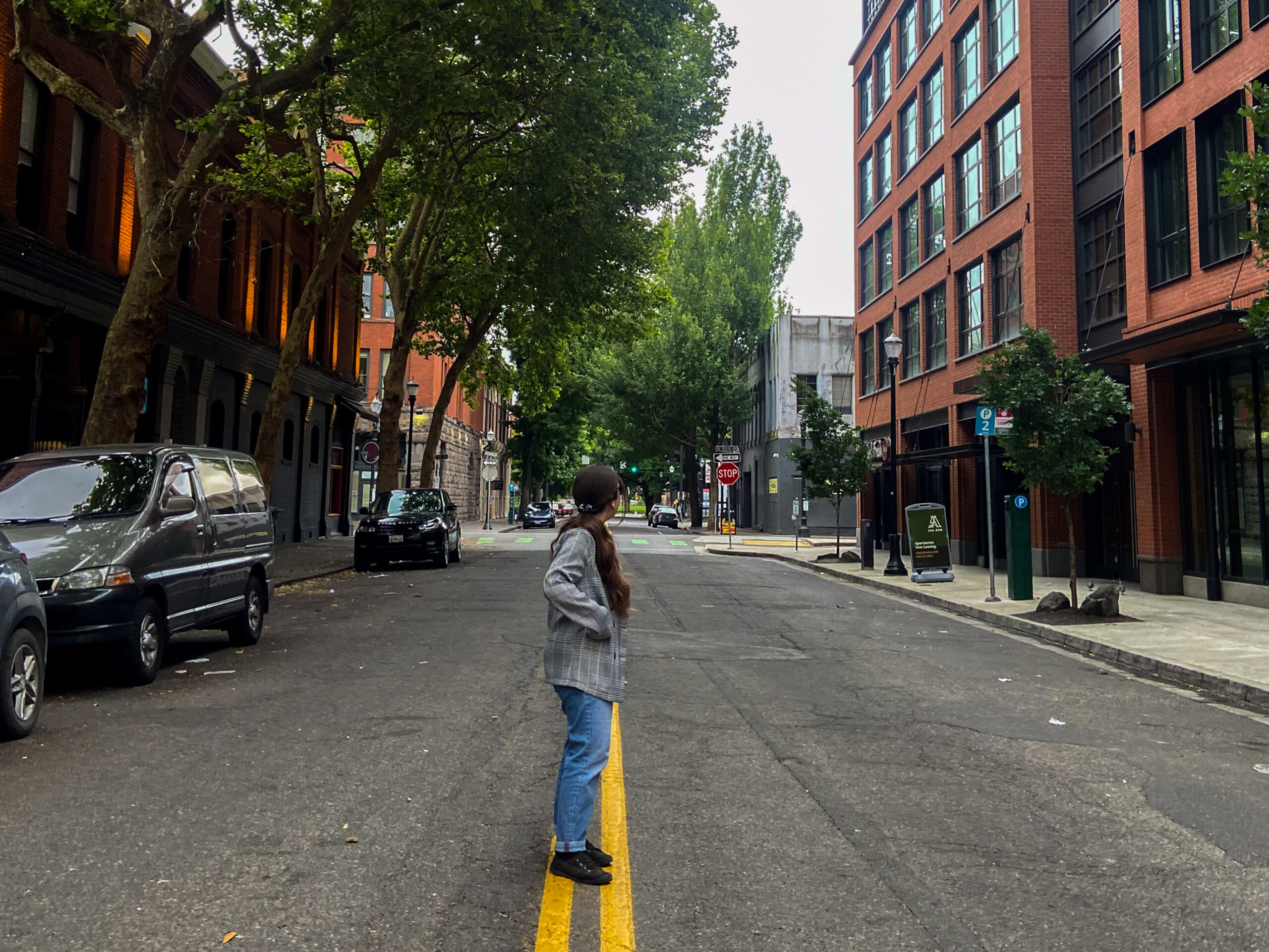 girl standing in the middle of the street in portland