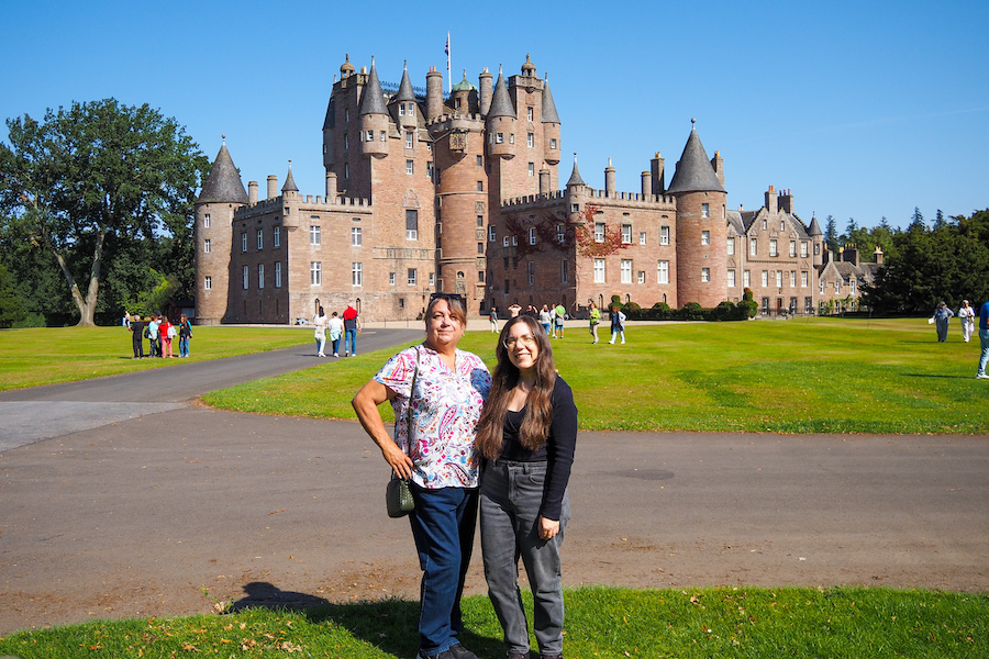 young woman and her mom posing in front of Glamis Castle